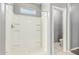 Bathroom with shower featuring tiled walls and a window at 3112 N 303Rd Dr, Buckeye, AZ 85396