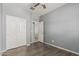 Bright bedroom with hardwood floors, ceiling fan, and closet at 3112 N 303Rd Dr, Buckeye, AZ 85396