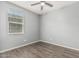 Bedroom featuring hardwood floors, a window with blinds, and ceiling fan at 3112 N 303Rd Dr, Buckeye, AZ 85396