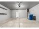 Spacious garage with epoxy floors, ample storage, and a utility sink at 3112 N 303Rd Dr, Buckeye, AZ 85396