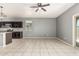 Open concept living space featuring tile floors and stainless steel appliances at 3112 N 303Rd Dr, Buckeye, AZ 85396