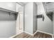 Walk-in closet featuring custom shelving and hardwood floors at 3112 N 303Rd Dr, Buckeye, AZ 85396