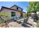 Inviting backyard patio featuring a cozy fire pit and comfortable seating area at 31332 N 137Th Ln, Peoria, AZ 85383