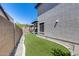 Backyard with a narrow strip of artificial lawn at 31332 N 137Th Ln, Peoria, AZ 85383