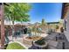 Backyard landscaping featuring gravel, artificial lawn, trees, and a pergola at 31332 N 137Th Ln, Peoria, AZ 85383