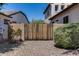 Gated backyard area with gravel landscaping and mature hedges for privacy at 31332 N 137Th Ln, Peoria, AZ 85383