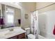 Full bathroom with vanity, toilet, shower-tub combo, and decorative curtain at 31332 N 137Th Ln, Peoria, AZ 85383