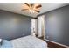 Bedroom with gray walls and wood floors, open door to hallway at 31332 N 137Th Ln, Peoria, AZ 85383