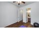 Bright bedroom with wood floors and easy access to an adjacent bathroom at 31332 N 137Th Ln, Peoria, AZ 85383