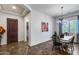 Inviting dining room with elegant chandelier, stylish furniture, and view into front entrance at 31332 N 137Th Ln, Peoria, AZ 85383