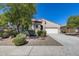 Charming single-story home with a tile roof, well-maintained landscaping, and a two-car garage at 31332 N 137Th Ln, Peoria, AZ 85383