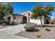 Well-maintained home with manicured landscaping, desert plants, and a welcoming front entrance at 31332 N 137Th Ln, Peoria, AZ 85383