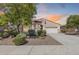 Charming single-story home with a tile roof, well-maintained landscaping, and a two-car garage at 31332 N 137Th Ln, Peoria, AZ 85383