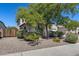 Two-story home with desert landscaping, a tile roof, and a well-maintained front yard at 31332 N 137Th Ln, Peoria, AZ 85383