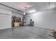Spacious two-car garage with ample storage and a clean, epoxy-coated floor at 31332 N 137Th Ln, Peoria, AZ 85383
