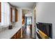 Hallway featuring tiled floors and access to the kitchen and living area at 31332 N 137Th Ln, Peoria, AZ 85383