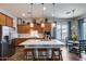 Bright kitchen features a large island, stainless steel appliances, and pendant lighting at 31332 N 137Th Ln, Peoria, AZ 85383