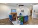 Cozy living room with fireplace, hardwood floors, and blue furnishings at 31332 N 137Th Ln, Peoria, AZ 85383
