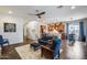 Spacious open-concept living area featuring stairs, living room, dining area, and gourmet kitchen at 31332 N 137Th Ln, Peoria, AZ 85383