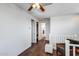 Upstairs loft area with hardwood floors, a ceiling fan, and a sitting area with views of the home at 31332 N 137Th Ln, Peoria, AZ 85383