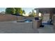 Backyard featuring a pool with a waterfall feature, grill, and patio furniture at 3247 E Lark Ct, Gilbert, AZ 85297