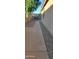 Long concrete path between the house and a rock landscape at 3247 E Lark Ct, Gilbert, AZ 85297