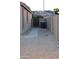 View of the side yard with a gate leading to the backyard with gravel landscaping at 3247 E Lark Ct, Gilbert, AZ 85297