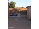 Low maintenance backyard features a refreshing pool with a waterfall, and desert landscaping at 3247 E Lark Ct, Gilbert, AZ 85297