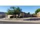 Attractive house front with desert landscaping, garage and healthy shade tree at 3247 E Lark Ct, Gilbert, AZ 85297