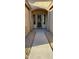 Covered front entrance with security door and desert landscaping at 3247 E Lark Ct, Gilbert, AZ 85297