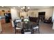 Bright living room featuring neutral walls, tile flooring, and a seamless flow to the kitchen at 3247 E Lark Ct, Gilbert, AZ 85297