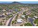 Expansive aerial view of a residential neighborhood with mountain views in the distance at 32826 N 54Th St, Cave Creek, AZ 85331