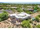 Expansive backyard with patio area, pergola, sparkling pool, and desert landscaping at 32826 N 54Th St, Cave Creek, AZ 85331