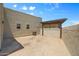 Private backyard area with stucco walls, gravel groundcover, and a shaded pergola at 32826 N 54Th St, Cave Creek, AZ 85331