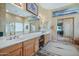 Bathroom with dual vanities, a tub, and tile flooring at 32826 N 54Th St, Cave Creek, AZ 85331