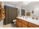 Traditional bathroom with a large vanity, single sink, neutral color scheme, and shower with curtain at 32826 N 54Th St, Cave Creek, AZ 85331