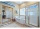 Elegant bathroom featuring a soaking tub and a glass enclosed shower at 32826 N 54Th St, Cave Creek, AZ 85331