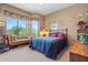 Comfortable bedroom with large windows and a seating area at 32826 N 54Th St, Cave Creek, AZ 85331
