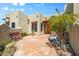 Charming courtyard featuring desert landscaping, a decorative fountain, and a sitting bench at 32826 N 54Th St, Cave Creek, AZ 85331