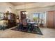 Elegant dining room with a large wooden table, upholstered chairs, and buffet at 32826 N 54Th St, Cave Creek, AZ 85331