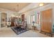 Well-lit dining room with a wooden table, upholstered chairs, and shuttered window at 32826 N 54Th St, Cave Creek, AZ 85331