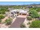 Stunning home featuring a desert landscape, a circular driveway, and a multi-car garage at 32826 N 54Th St, Cave Creek, AZ 85331