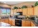 Traditional kitchen boasts granite countertops, appliances, and lots of natural light at 32826 N 54Th St, Cave Creek, AZ 85331