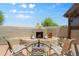 Outdoor living with fireplace and skyline view, an inviting space for relaxation and entertainment at 32826 N 54Th St, Cave Creek, AZ 85331