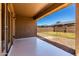 A covered back patio extends into the yard at 36538 W La Paz St, Maricopa, AZ 85138