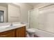 Bathroom featuring a wooden vanity, tile flooring, and a shower with sliding doors at 36538 W La Paz St, Maricopa, AZ 85138