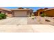 Charming single-story home featuring a two-car garage and low maintenance desert landscaping at 36538 W La Paz St, Maricopa, AZ 85138