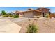 Beautiful house with desert landscaping, a two-car garage, and a well-maintained yard at 36538 W La Paz St, Maricopa, AZ 85138