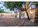 Exterior view of a home with a private backyard, patio area, sliding glass doors, and mature landscaping at 4016 W Royal Palm Rd, Phoenix, AZ 85051