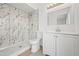 Bathroom featuring modern finishes, a marble-tiled shower-tub, and vanity with white cabinets at 4016 W Royal Palm Rd, Phoenix, AZ 85051